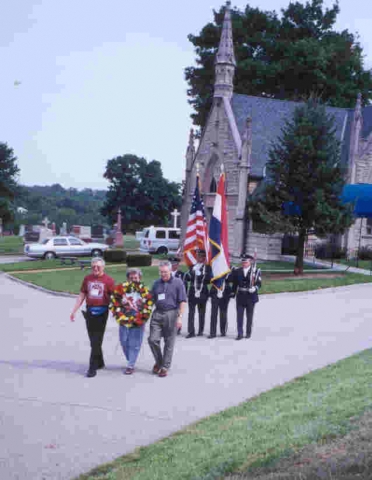 Honor guard procession to Joseph monument.