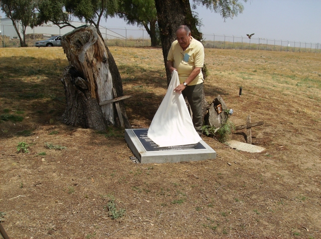 Ben Rubidoux, of the Louis Rubidoux Pathfinders, unveiling the monument to Louis on his gravesite in Agua Mansa Cemetary.