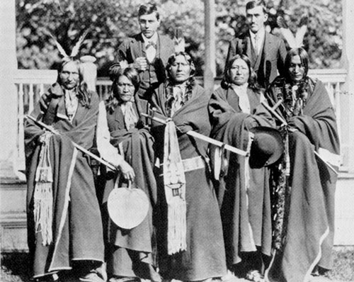 BrulÃ© delegation at Carlisle Indian School in 1880. left to right: Black Crow, Two Strike, White Thunder, Spotted Tail, and Iron Wing. The two white men in the back are Interpreter Louis Roubedeaux and Charles Tackett, Spotted Tails brother in law.

co