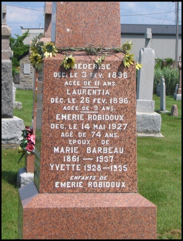 The back of the monument shows Mederise Robidoux (9E3b4g1e2) who died in 1896 at the age of 11 years of age, and her sister, Laurentia, (9E3b4g1e3) d. 1896 at 9 years of age. Both are the daughters of Emery Robidoux (8E3b4g13) and Madeleine Barbeau, who a